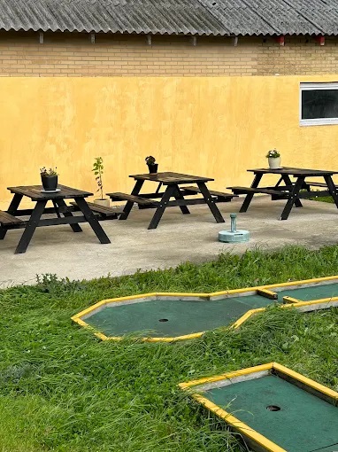 Family playing minigolf